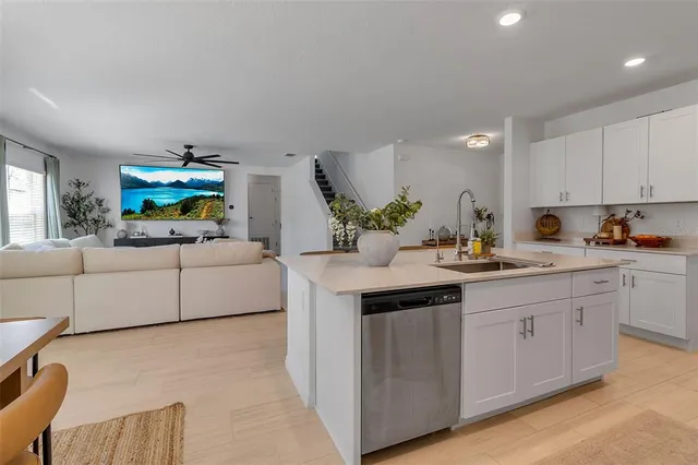 a bathroom with a sink a toilet and shower curtain