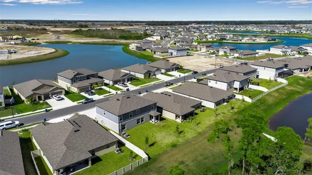 a view of a backyard with sitting area
