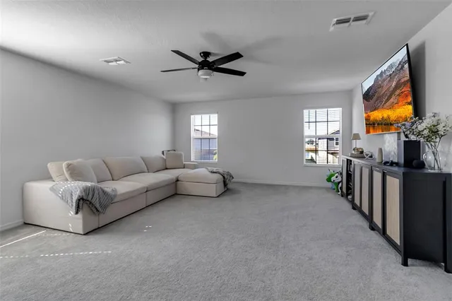 a bathroom with double sink and a mirror