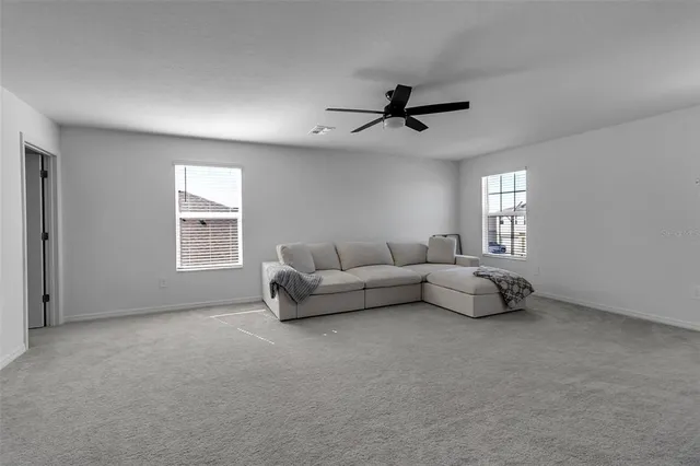 a view of a chairs and table in a backyard