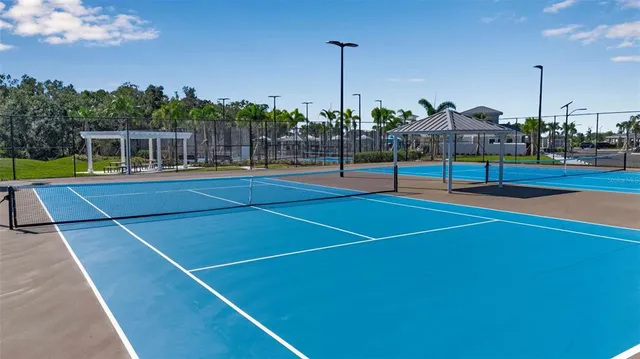 a kitchen with refrigerator and cabinets
