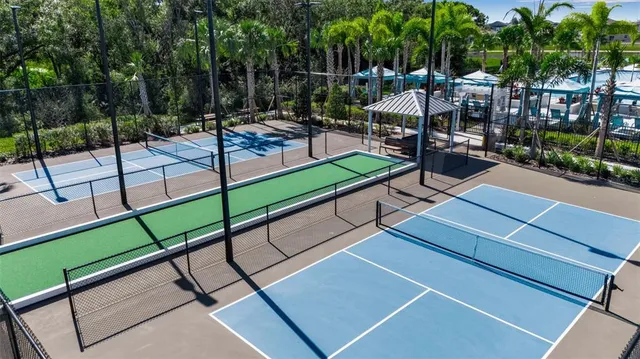 a large kitchen with a table and chairs