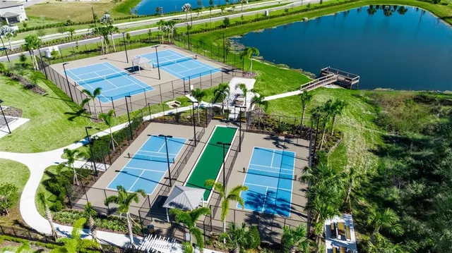 a kitchen with a sink a microwave and cabinets