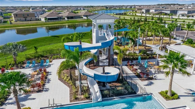 a kitchen with stainless steel appliances granite countertop a refrigerator sink and cabinets