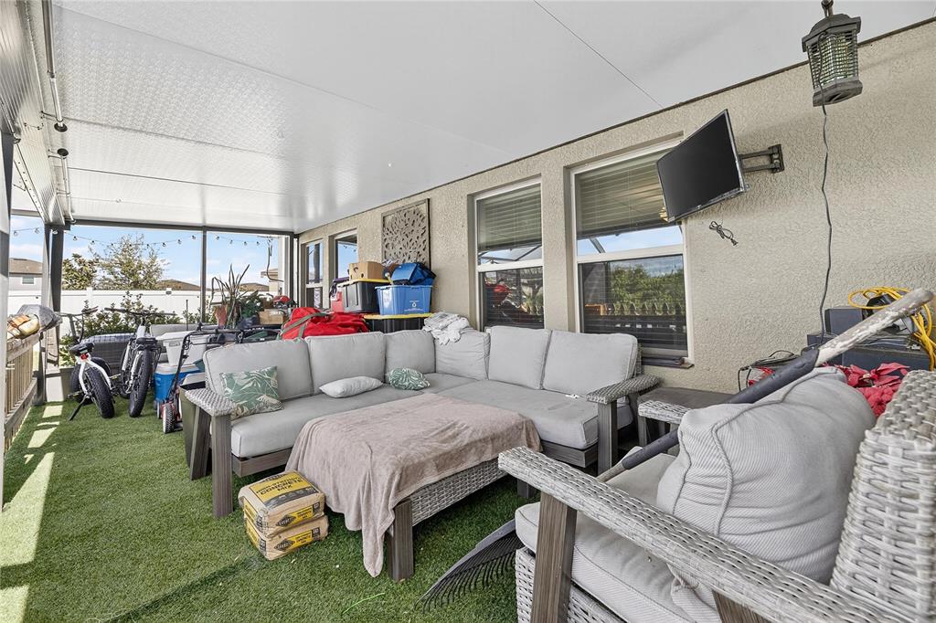 13503 Wild Ginger Street Riverview, FL 33579 - Photo 26 of 31 a living room with furniture and a floor to ceiling window