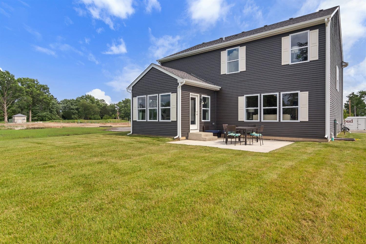 8686 Burr Rdg Circle Crown Point, IN 46307 - Photo 24 of 24 a front view of house with outdoor seating and yard