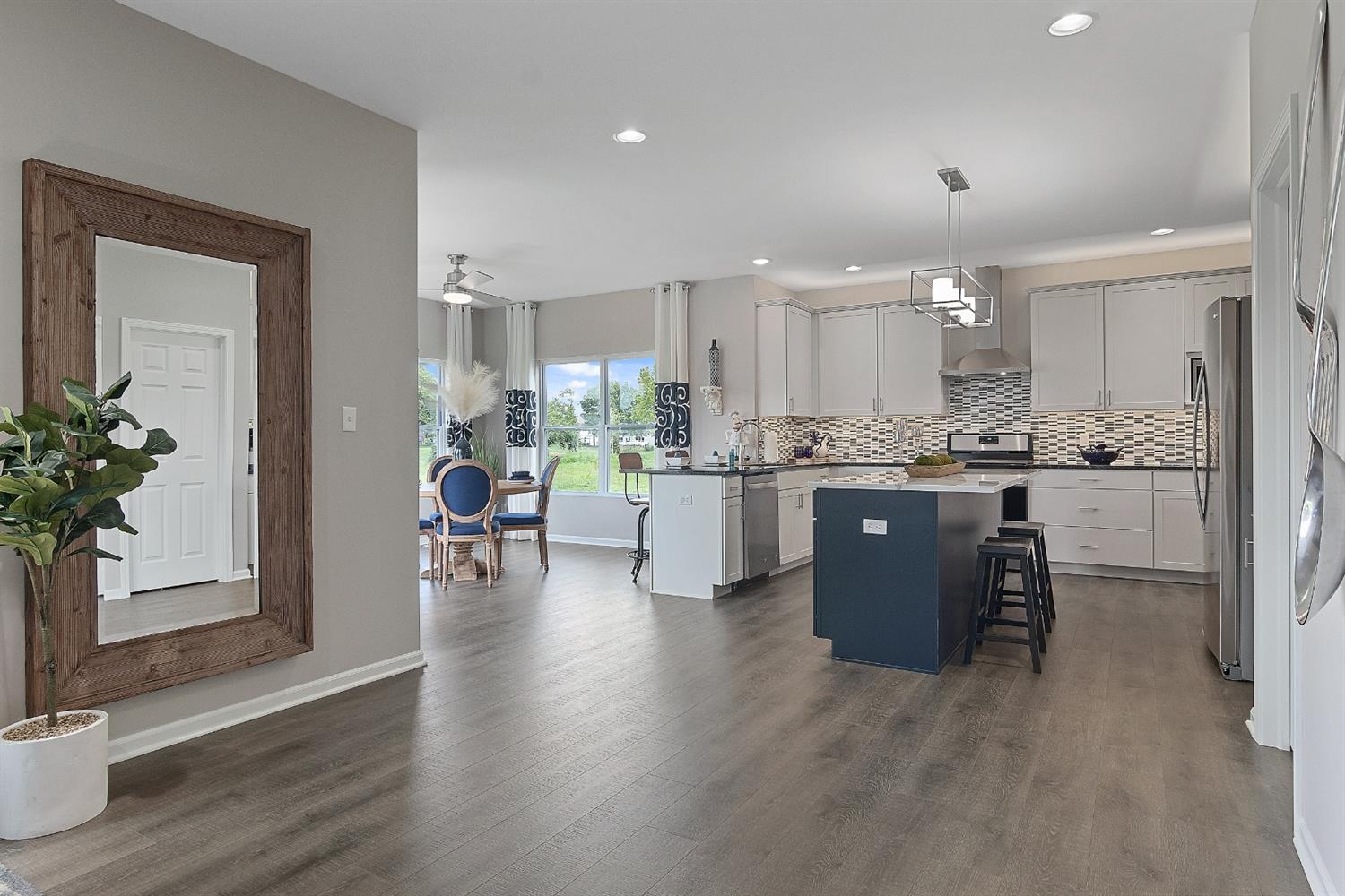 8686 Burr Rdg Circle Crown Point, IN 46307 - Photo 7 of 24 a kitchen with a table and chairs