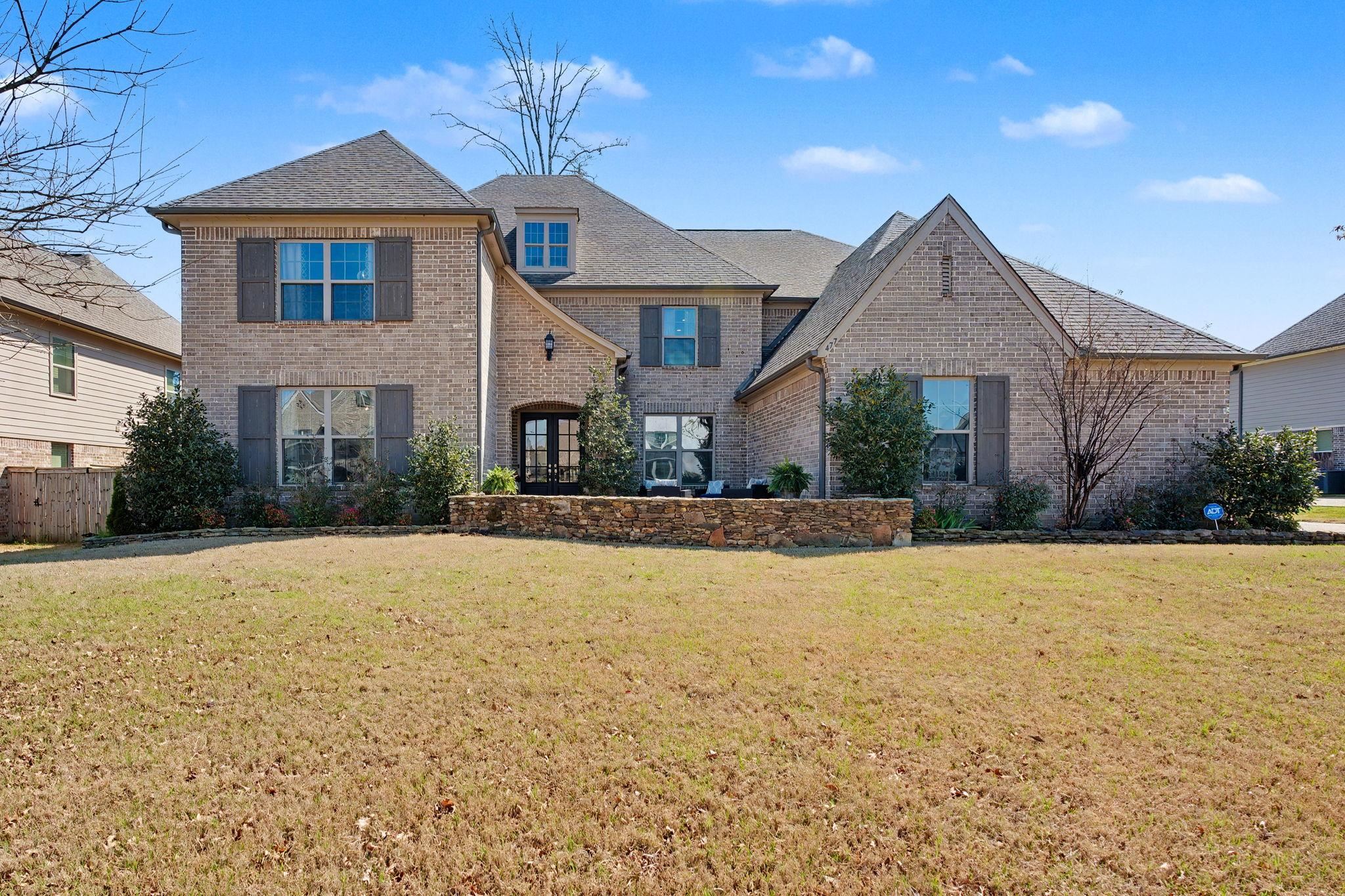 477 Fallen Timbers Cove Collierville, TN 38017 - Photo 1 of 40 a front view of a house with a yard