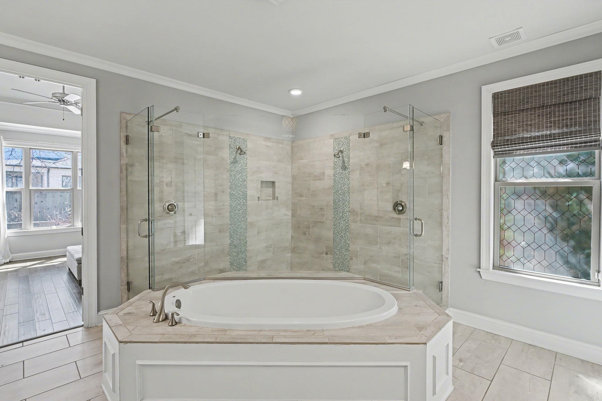 477 Fallen Timbers Cove Collierville, TN 38017 - Photo 19 of 40 a white bath tub sitting next to a shower