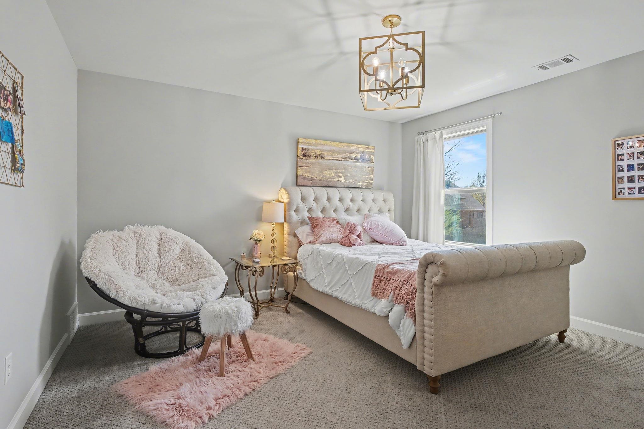 477 Fallen Timbers Cove Collierville, TN 38017 - Photo 28 of 40 a bedroom with bed and a window