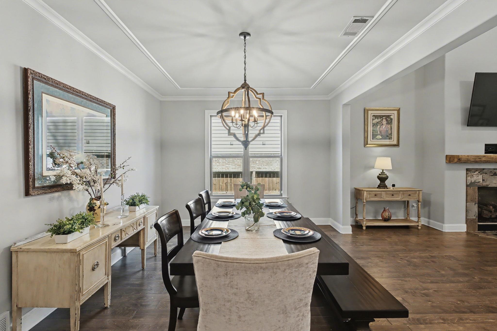 477 Fallen Timbers Cove Collierville, TN 38017 - Photo 10 of 40 a dining room with furniture a chandelier and window