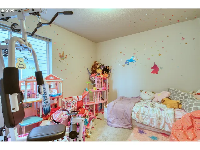 a bedroom with furniture and a chandelier