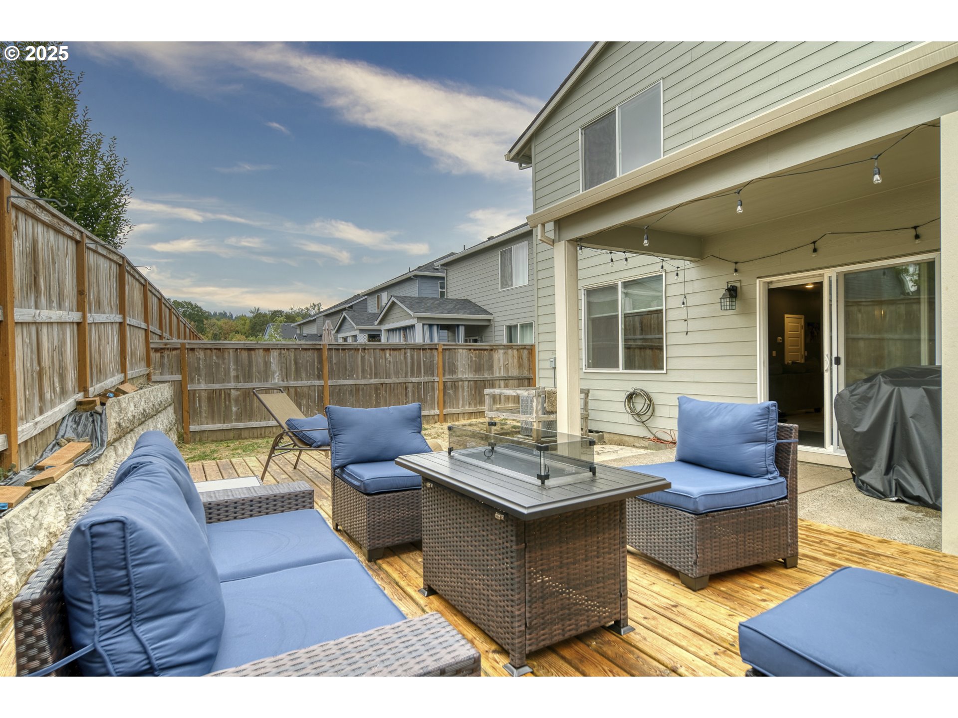 175 Kindre Street St. Helens, OR 97051 - Photo 21 of 22 a view of a deck with couches table and chairs with wooden floor
