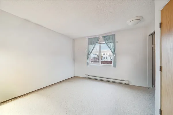 a kitchen with stainless steel appliances granite countertop a refrigerator a stove a sink and a microwave