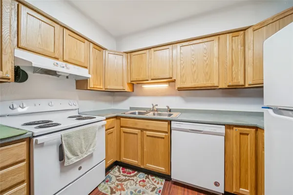 a bathroom with a sink and mirror with toilet