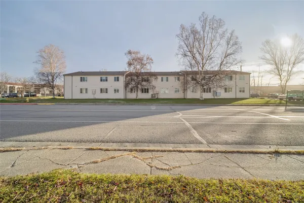 a view of an apartment with a swimming pool