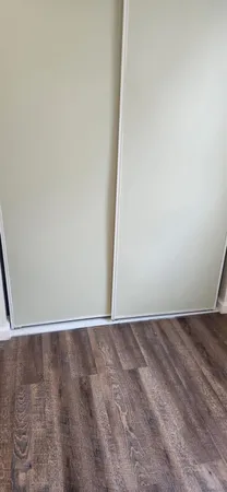 a stove top oven sitting inside of a kitchen