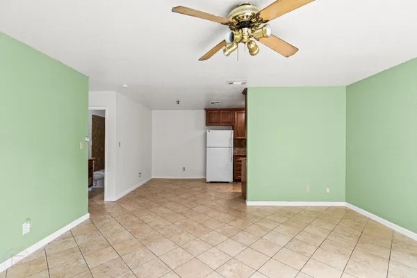 a view of a livingroom with a chandelier fan