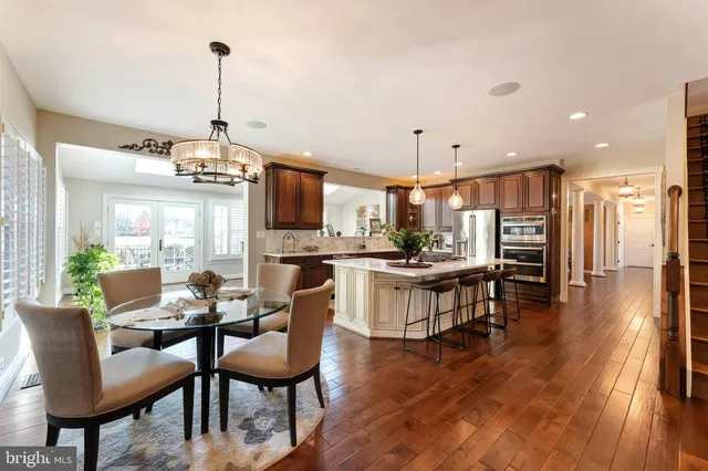 a view of a livingroom with furniture and a bookshelf
