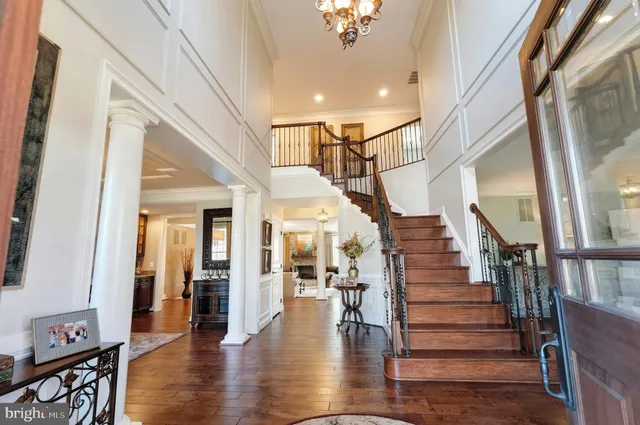a living room with furniture a window and a potted plant