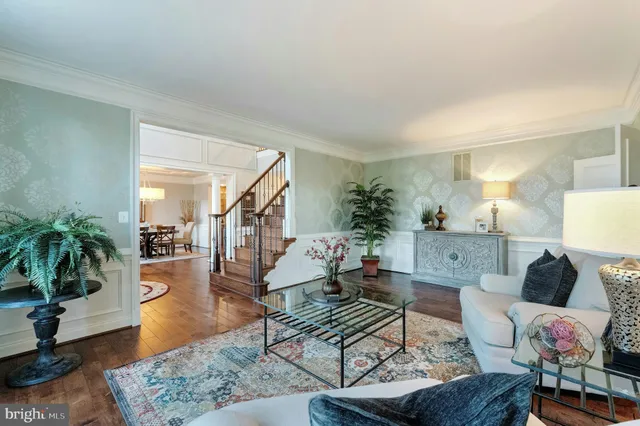 a dining room with furniture and wooden floor