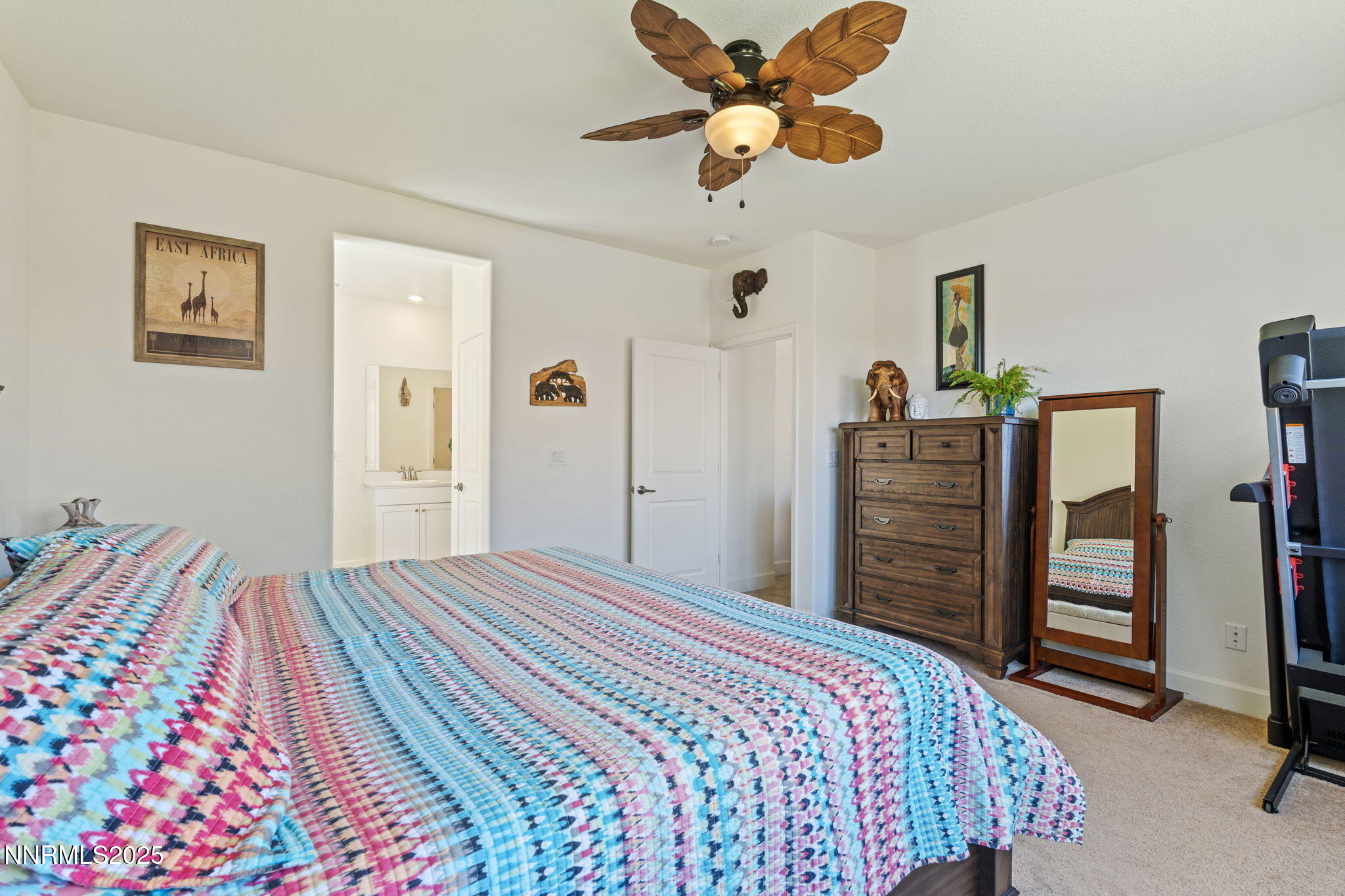 6421 Eagle Peak Drive Carson City, NV 89701 - Photo 16 of 38 a bedroom with a bed and a chandelier