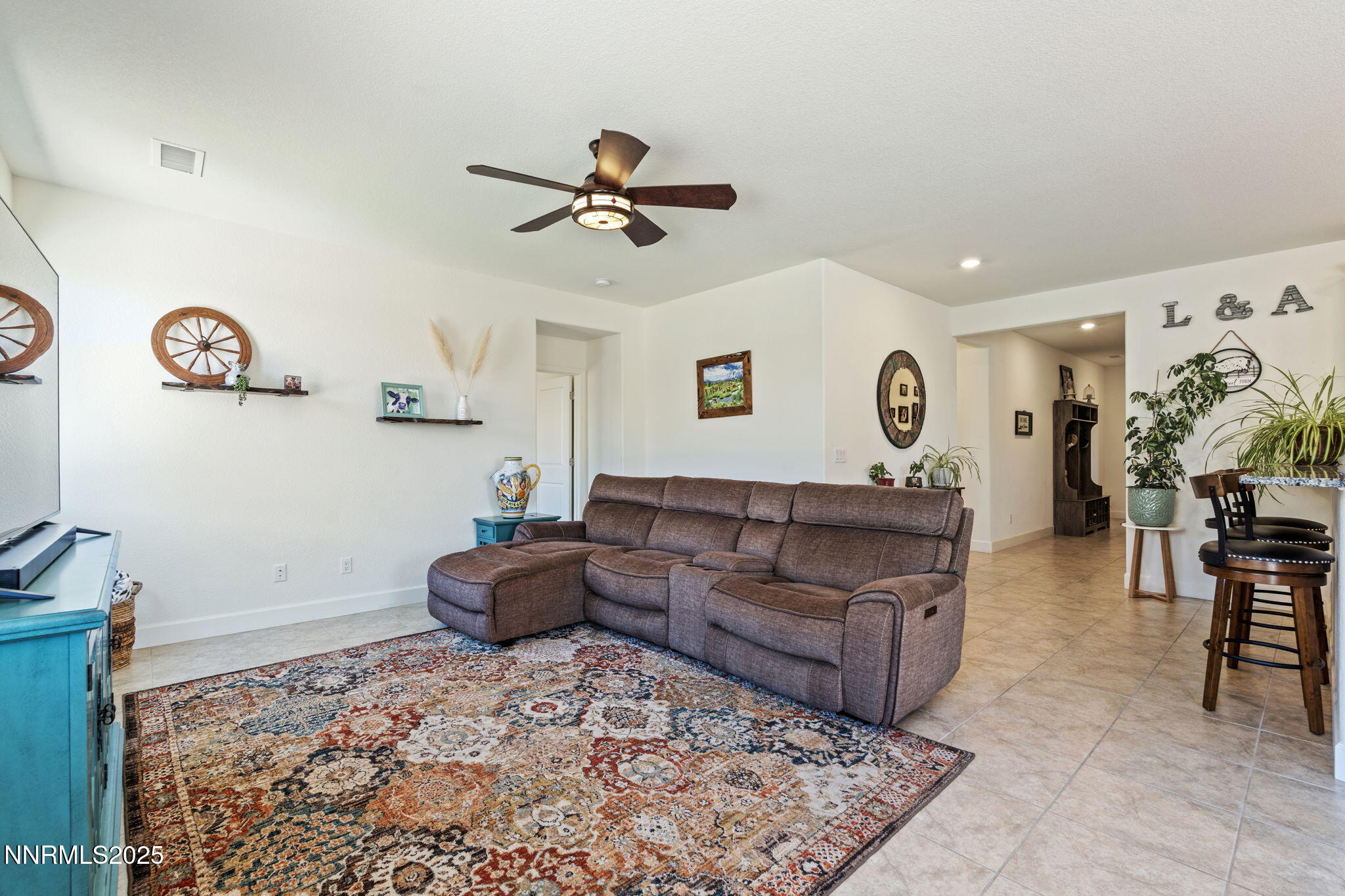 6421 Eagle Peak Drive Carson City, NV 89701 - Photo 3 of 38 a living room with furniture and a rug