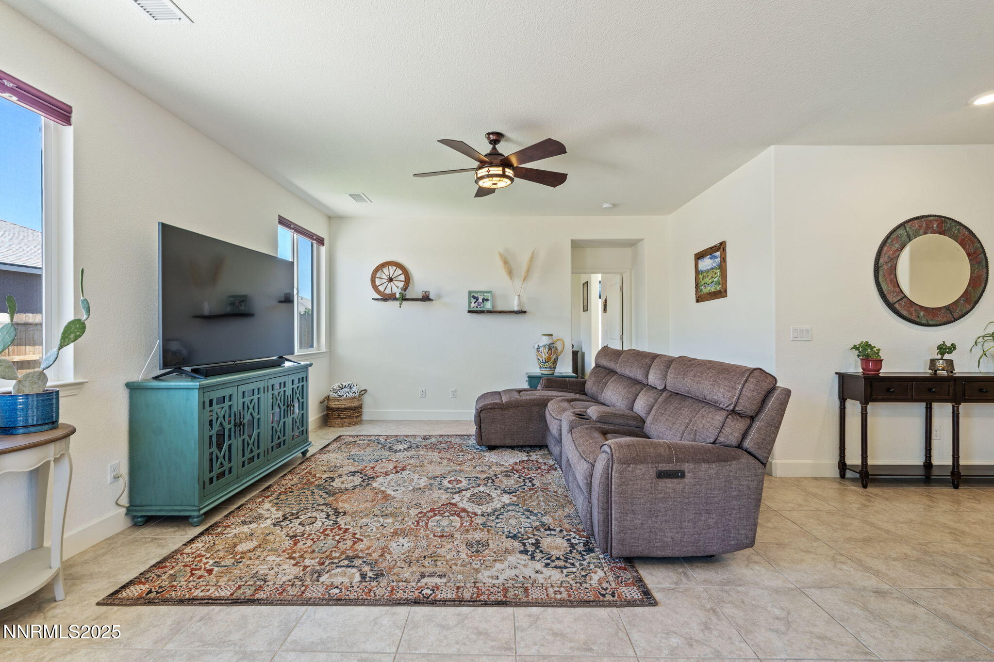 6421 Eagle Peak Drive Carson City, NV 89701 - Photo 4 of 38 a living room with furniture and a flat screen tv