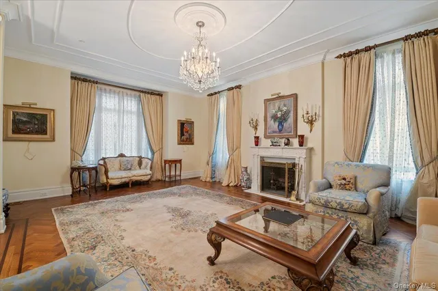 a living room with furniture fireplace and window