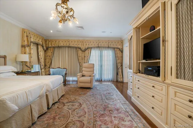 a spacious bathroom with a granite countertop sink mirror and bathtub