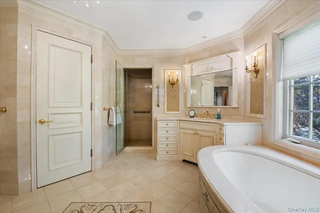 a spacious bedroom with a bed and a large window