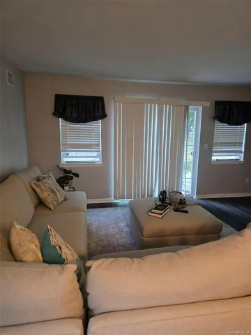 a living room with furniture and window