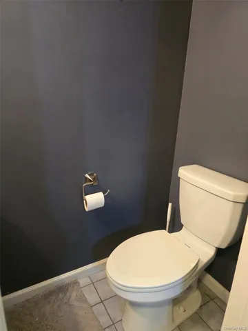 a bathroom with a toilet and a sink