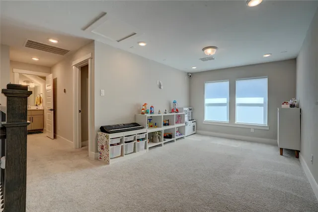 a view of a backyard with a small cabin and wooden fence