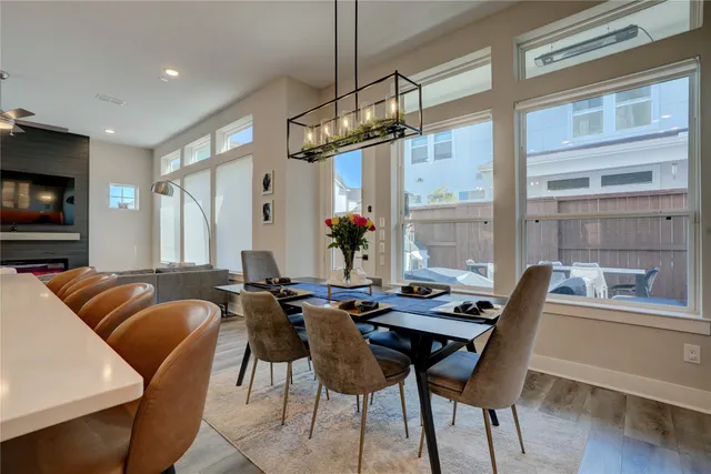 a view of a dining room with furniture window and wooden floor