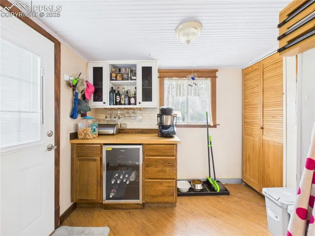 a view of living room with a flat screen tv and floor to ceiling window