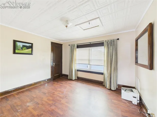 a view of an empty room with a window