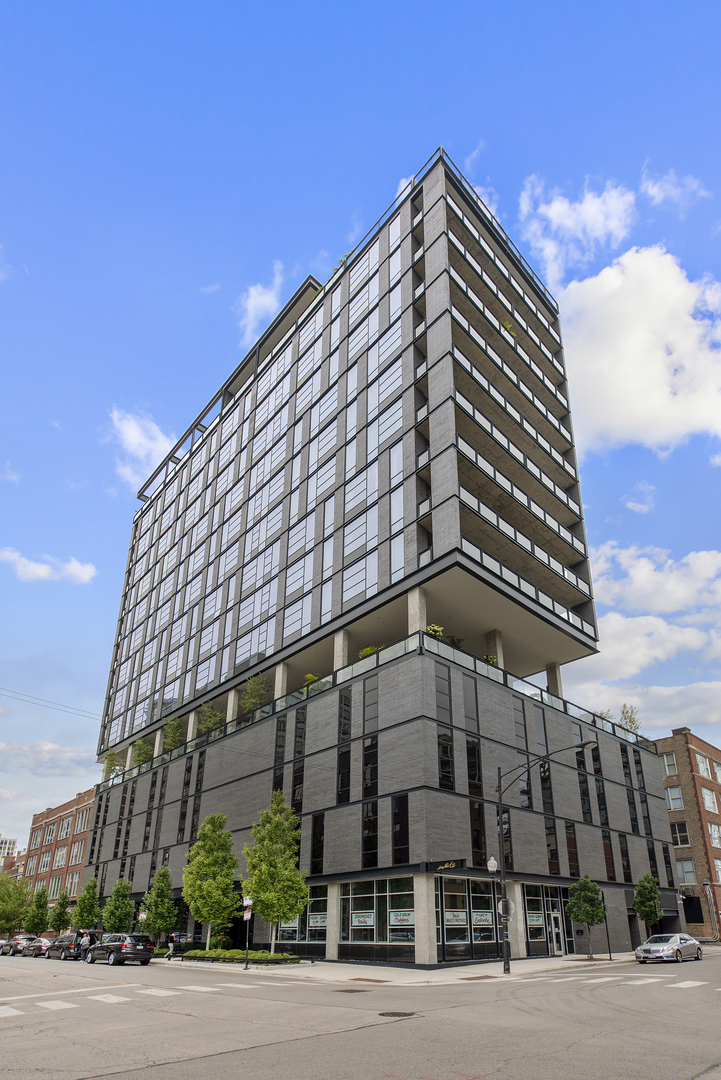 400 West Huron Street, Unit 701 Chicago, IL 60654 - Photo 1 of 24 a tall building sitting on the side of a street