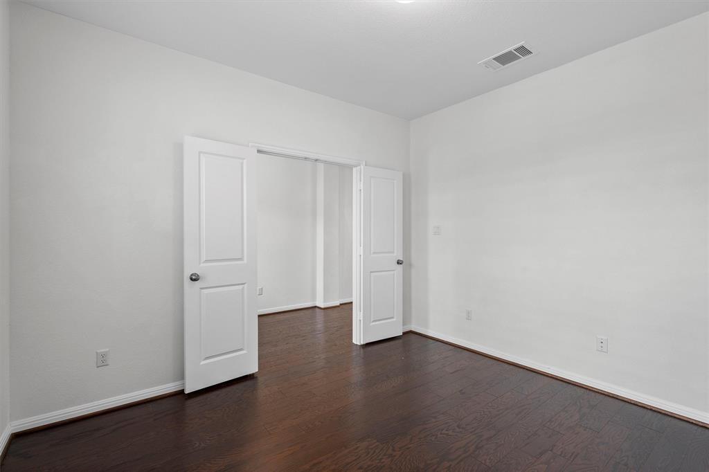 236 Prato Place Georgetown, TX 78628 - Photo 8 of 40 Rich hardwood floors extend through this versatile, freshly painted room with double doors.