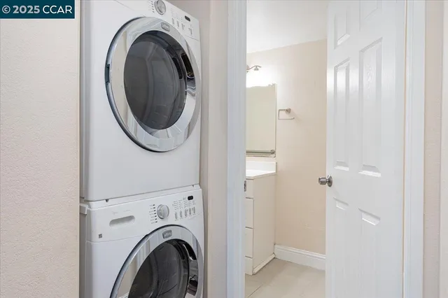 a view of a hallway with washer and dryer