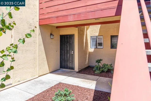 an entrance to house with yard