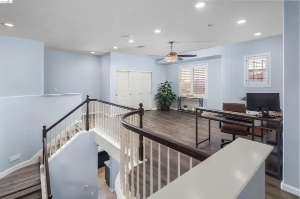 a bedroom with a bed and a television