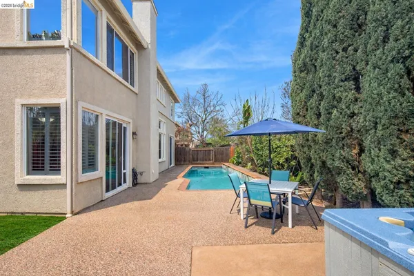 aerial view of a house with a yard