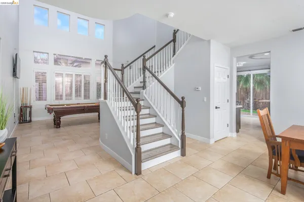 a view of entryway with livingroom and stairs