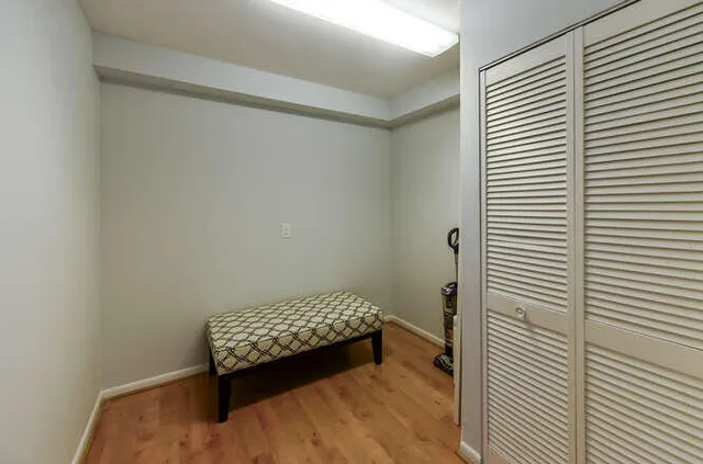 a bedroom with a bed and a shower