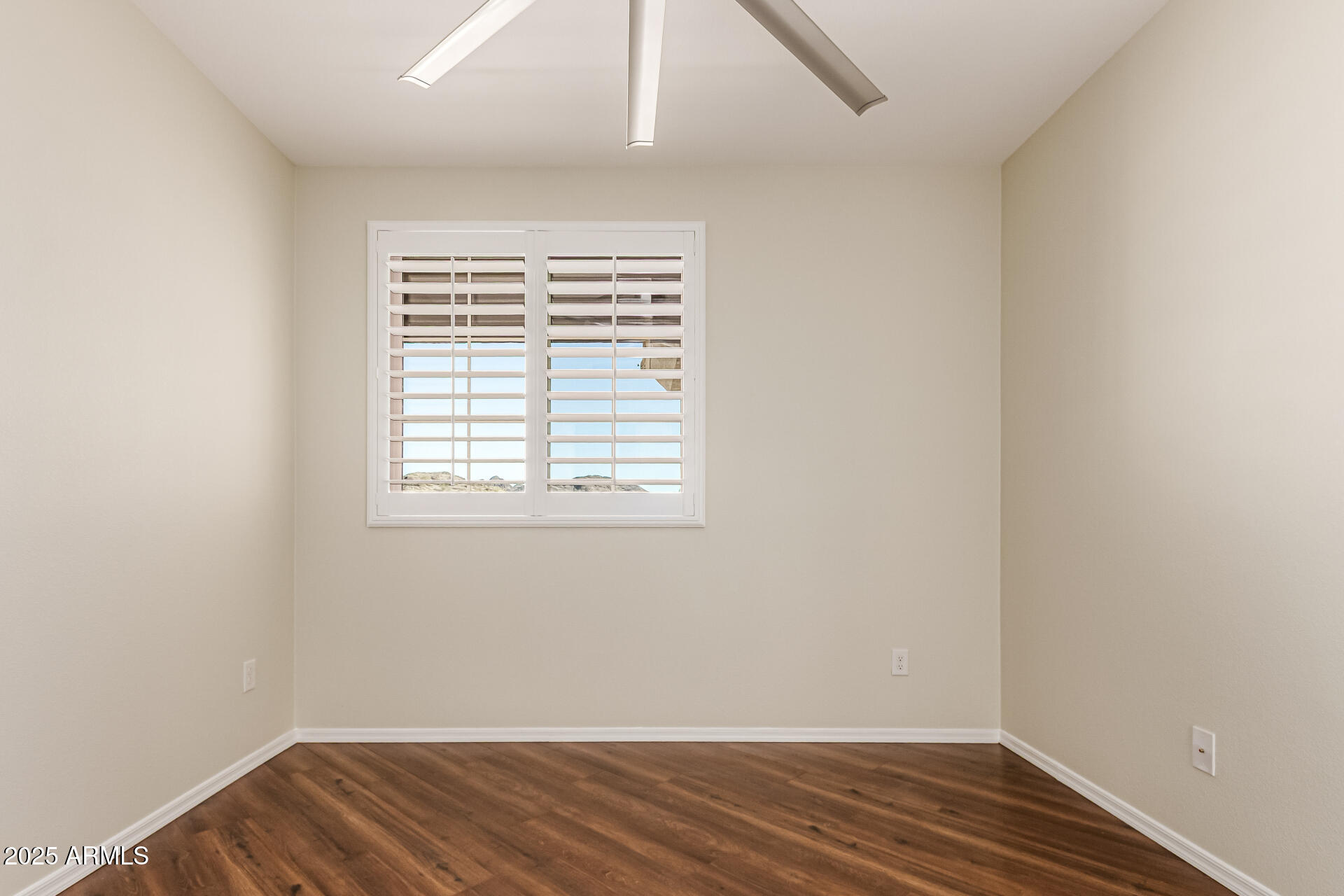 1720 East Thunderbird Road, Unit 2125 Phoenix, AZ 85022 - Photo 15 of 37 an empty room with wooden floor and windows