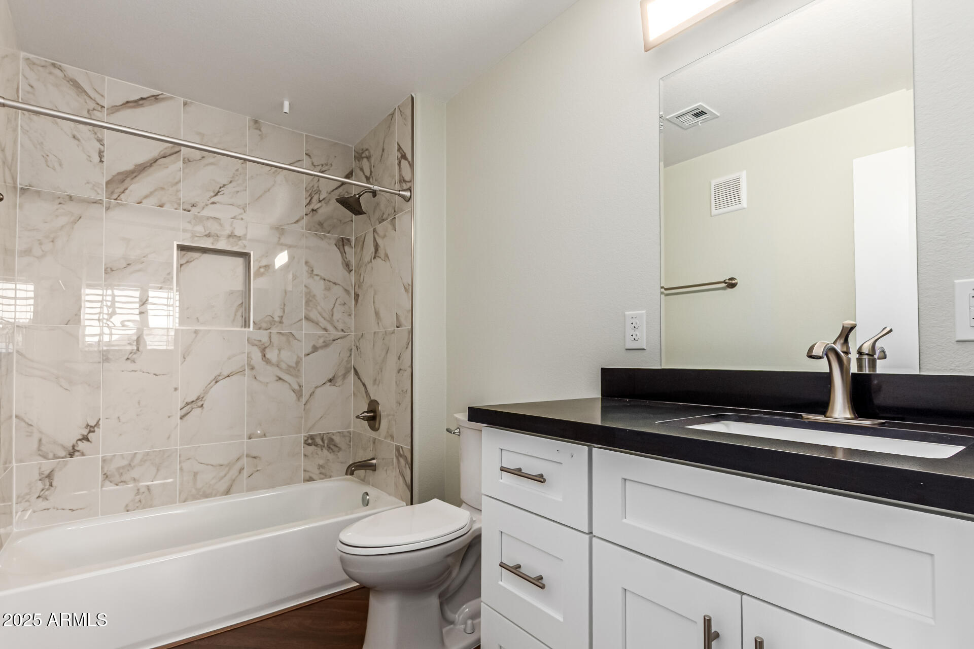 1720 East Thunderbird Road, Unit 2125 Phoenix, AZ 85022 - Photo 19 of 37 a bathroom with a sink a toilet and bathtub