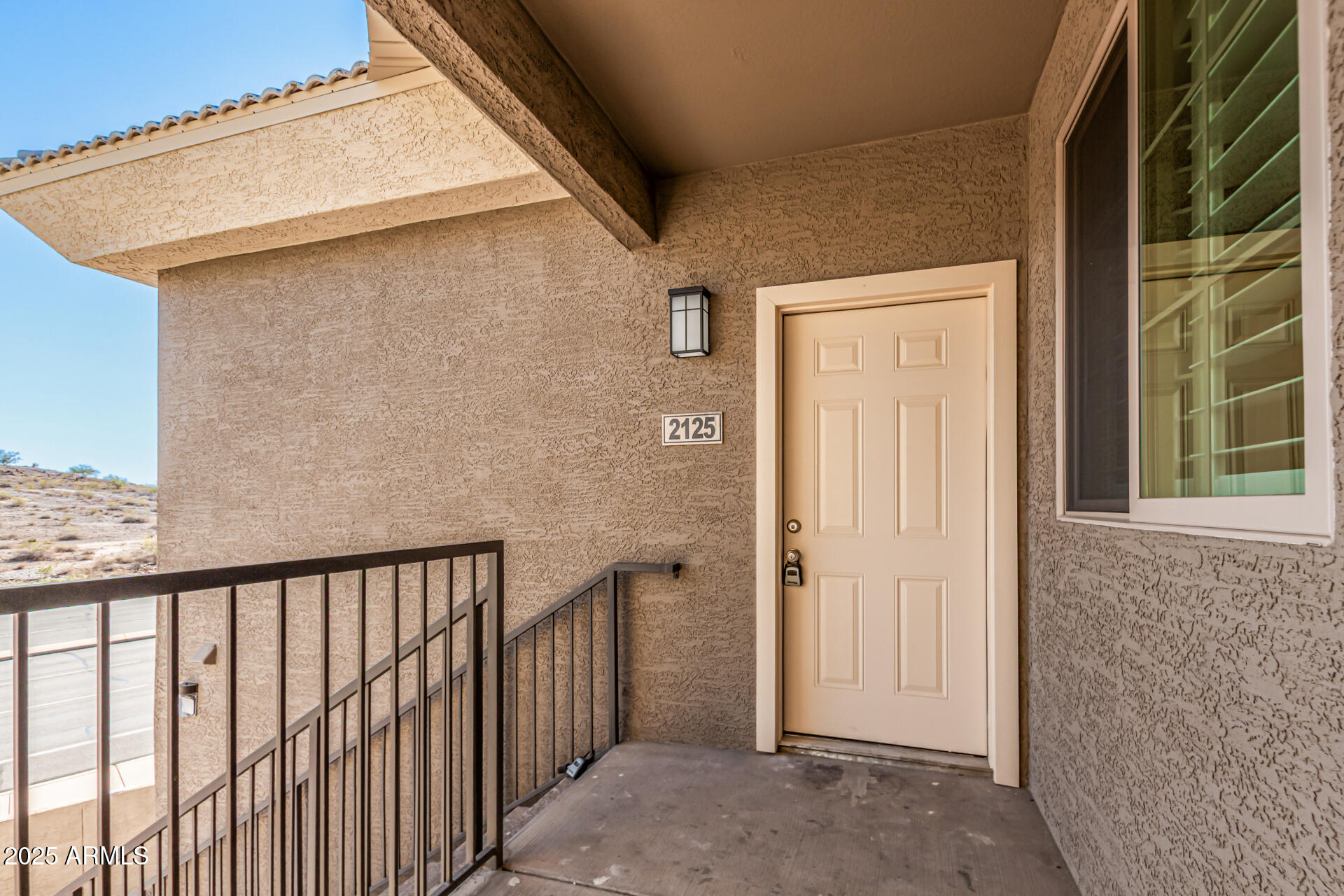 1720 East Thunderbird Road, Unit 2125 Phoenix, AZ 85022 - Photo 2 of 37 a view of a house with a wooden fence