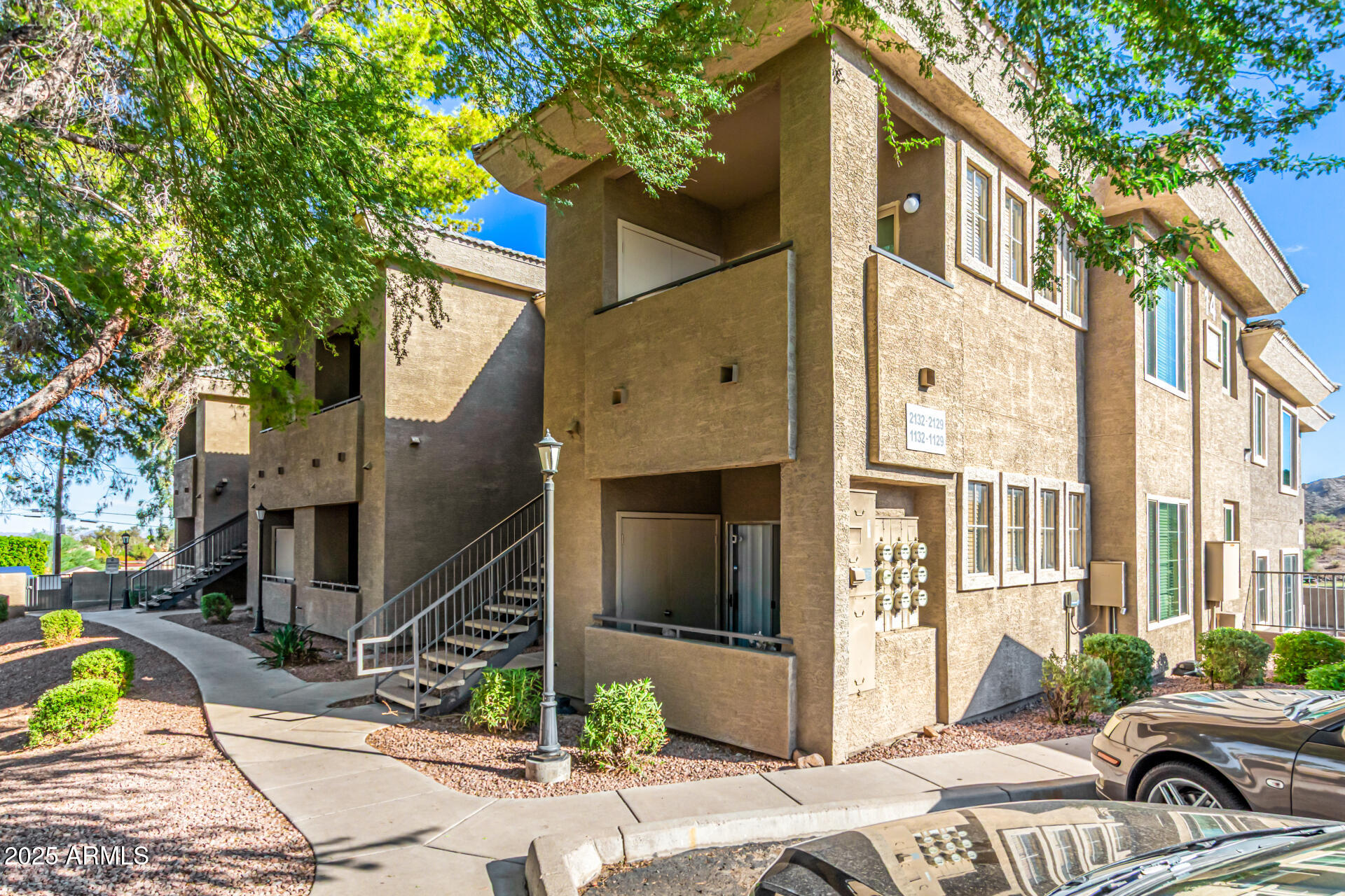 1720 East Thunderbird Road, Unit 2125 Phoenix, AZ 85022 - Photo 24 of 37 a front view of a house with parking area
