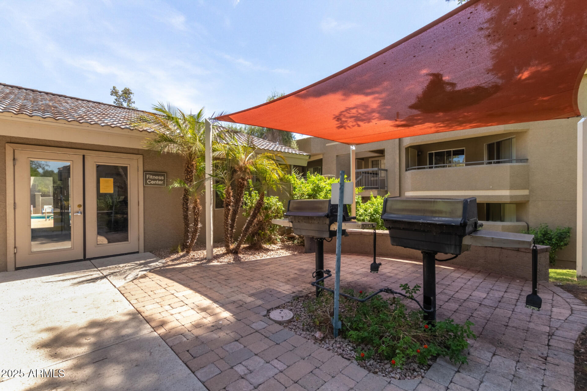 1720 East Thunderbird Road, Unit 2125 Phoenix, AZ 85022 - Photo 32 of 37 a backyard of a house with outdoor seating